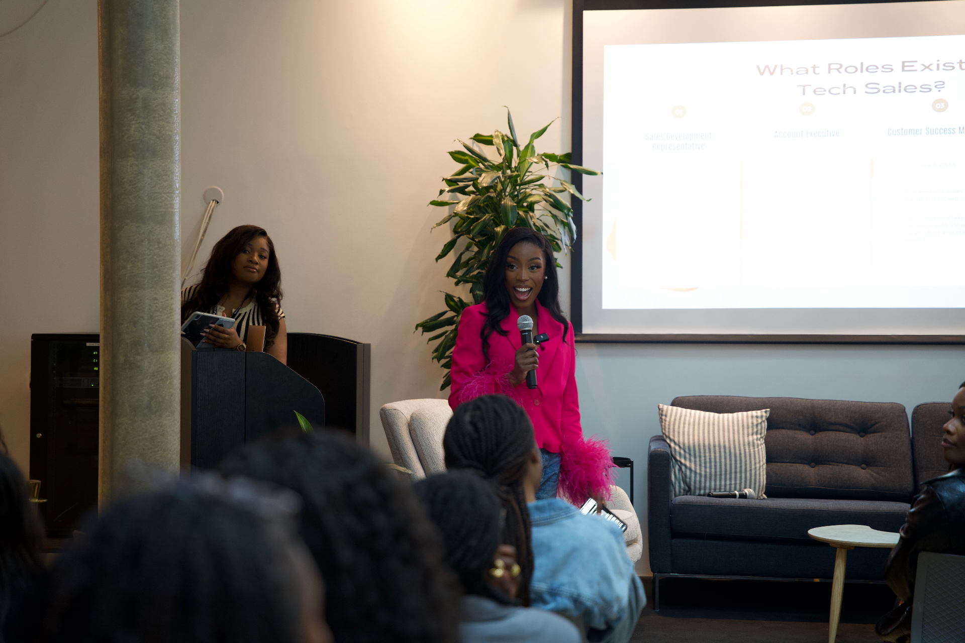 Eniola speaking to a room of women at a TeachHerSales event